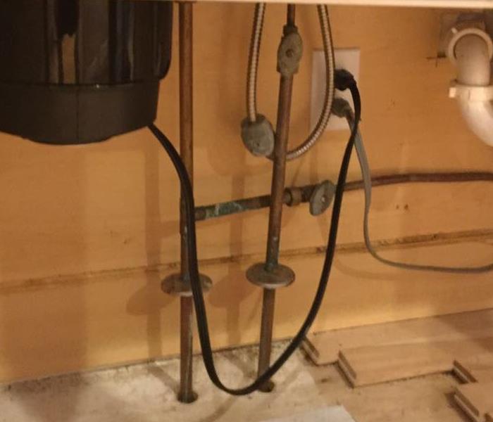 pipe under cabinet